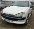 Белый Пежо 206, объемом двигателя 1.1 л и пробегом 387 тыс. км за 1600 $, фото 1 на Automoto.ua