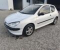 Белый Пежо 206, объемом двигателя 1.4 л и пробегом 271 тыс. км за 1554 $, фото 1 на Automoto.ua
