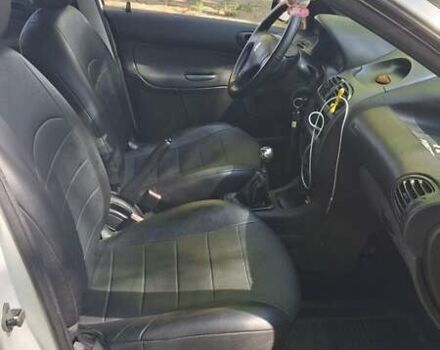 Белый Пежо 206, объемом двигателя 1.4 л и пробегом 235 тыс. км за 4100 $, фото 3 на Automoto.ua