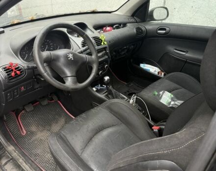 Черный Пежо 206, объемом двигателя 1.4 л и пробегом 240 тыс. км за 1200 $, фото 4 на Automoto.ua