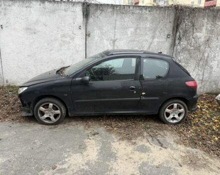 Черный Пежо 206, объемом двигателя 1.4 л и пробегом 240 тыс. км за 1200 $, фото 1 на Automoto.ua