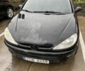 Черный Пежо 206, объемом двигателя 1.6 л и пробегом 237 тыс. км за 700 $, фото 1 на Automoto.ua