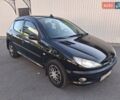 Черный Пежо 206, объемом двигателя 1.59 л и пробегом 176 тыс. км за 3000 $, фото 1 на Automoto.ua