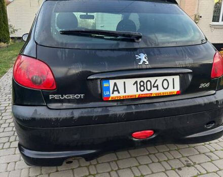 Черный Пежо 206, объемом двигателя 1.36 л и пробегом 142 тыс. км за 3500 $, фото 1 на Automoto.ua