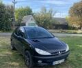 Черный Пежо 206, объемом двигателя 1.59 л и пробегом 240 тыс. км за 3100 $, фото 1 на Automoto.ua
