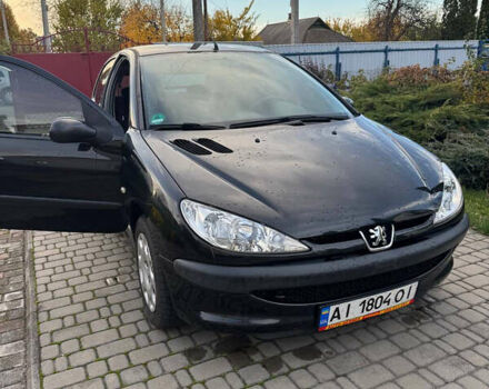 Черный Пежо 206, объемом двигателя 1.36 л и пробегом 142 тыс. км за 3500 $, фото 2 на Automoto.ua
