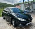 Черный Пежо 206, объемом двигателя 1.36 л и пробегом 355 тыс. км за 2300 $, фото 1 на Automoto.ua