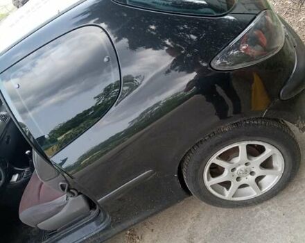 Чорний Пежо 206, об'ємом двигуна 1.4 л та пробігом 300 тис. км за 2000 $, фото 3 на Automoto.ua