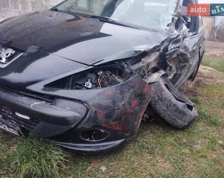 Черный Пежо 206, объемом двигателя 1.4 л и пробегом 250 тыс. км за 2000 $, фото 2 на Automoto.ua