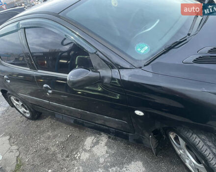 Черный Пежо 206, объемом двигателя 1.1 л и пробегом 335 тыс. км за 3200 $, фото 4 на Automoto.ua