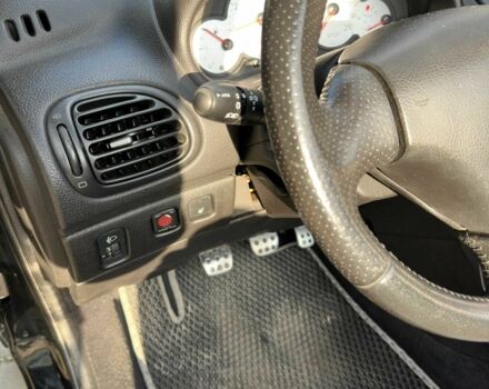 Черный Пежо 206, объемом двигателя 1.6 л и пробегом 230 тыс. км за 4096 $, фото 12 на Automoto.ua