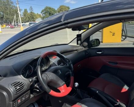 Черный Пежо 206, объемом двигателя 1.6 л и пробегом 175 тыс. км за 4700 $, фото 7 на Automoto.ua