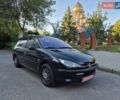 Черный Пежо 206, объемом двигателя 1.4 л и пробегом 202 тыс. км за 3950 $, фото 1 на Automoto.ua
