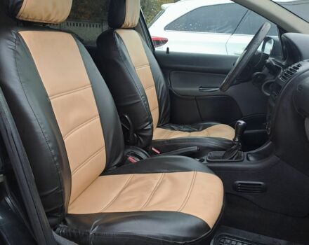 Черный Пежо 206, объемом двигателя 1.4 л и пробегом 406 тыс. км за 2000 $, фото 4 на Automoto.ua