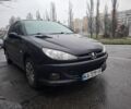 Черный Пежо 206, объемом двигателя 1.4 л и пробегом 151 тыс. км за 3900 $, фото 1 на Automoto.ua