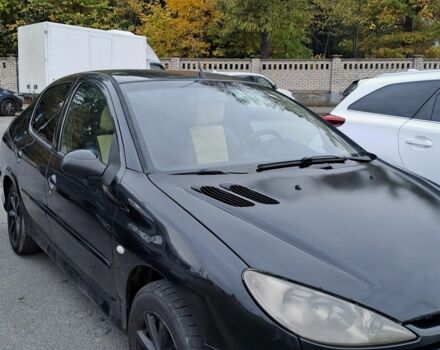 Черный Пежо 206, объемом двигателя 1.4 л и пробегом 406 тыс. км за 2000 $, фото 1 на Automoto.ua