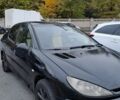 Черный Пежо 206, объемом двигателя 1.4 л и пробегом 406 тыс. км за 2000 $, фото 1 на Automoto.ua