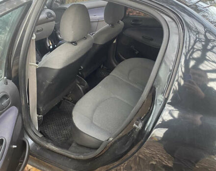 Черный Пежо 206, объемом двигателя 1.4 л и пробегом 148 тыс. км за 2100 $, фото 5 на Automoto.ua