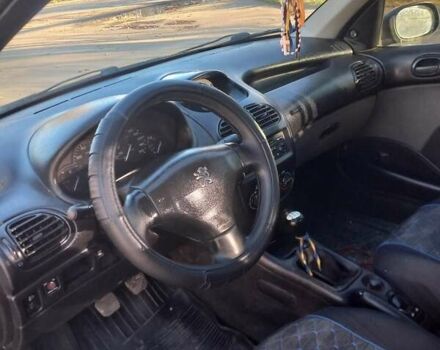 Черный Пежо 206, объемом двигателя 1.36 л и пробегом 270 тыс. км за 1900 $, фото 9 на Automoto.ua