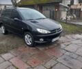 Черный Пежо 206, объемом двигателя 1.4 л и пробегом 298 тыс. км за 2896 $, фото 1 на Automoto.ua