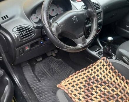 Черный Пежо 206, объемом двигателя 1.4 л и пробегом 286 тыс. км за 3160 $, фото 12 на Automoto.ua