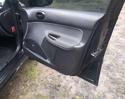 Черный Пежо 206, объемом двигателя 1.4 л и пробегом 286 тыс. км за 3160 $, фото 7 на Automoto.ua