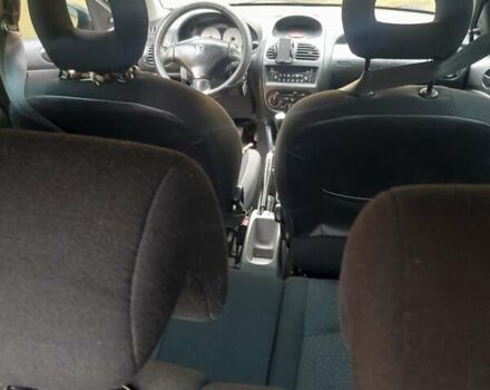 Черный Пежо 206, объемом двигателя 1.4 л и пробегом 286 тыс. км за 3160 $, фото 1 на Automoto.ua