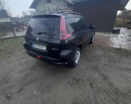 Черный Пежо 206, объемом двигателя 1.4 л и пробегом 298 тыс. км за 2896 $, фото 4 на Automoto.ua