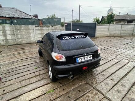 Черный Пежо 206, объемом двигателя 1.4 л и пробегом 366 тыс. км за 1700 $, фото 1 на Automoto.ua