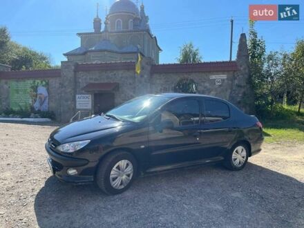 Черный Пежо 206, объемом двигателя 1.36 л и пробегом 230 тыс. км за 3200 $, фото 1 на Automoto.ua