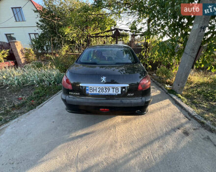 Черный Пежо 206, объемом двигателя 1.36 л и пробегом 161 тыс. км за 2500 $, фото 1 на Automoto.ua