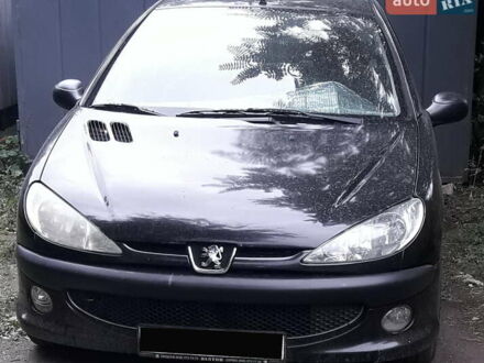 Черный Пежо 206, объемом двигателя 1.36 л и пробегом 107 тыс. км за 3900 $, фото 1 на Automoto.ua