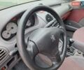 Красный Пежо 206, объемом двигателя 1.36 л и пробегом 230 тыс. км за 2200 $, фото 35 на Automoto.ua