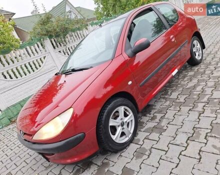 Красный Пежо 206, объемом двигателя 1.36 л и пробегом 230 тыс. км за 2200 $, фото 20 на Automoto.ua