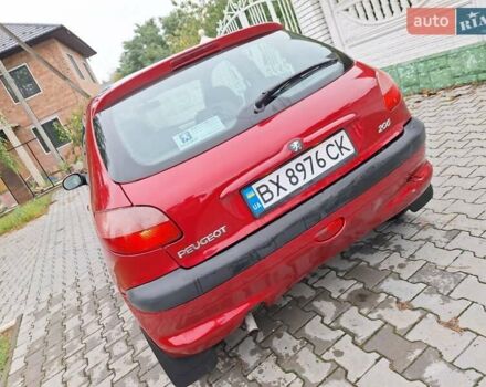 Красный Пежо 206, объемом двигателя 1.36 л и пробегом 230 тыс. км за 2200 $, фото 3 на Automoto.ua