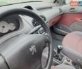 Красный Пежо 206, объемом двигателя 1.36 л и пробегом 230 тыс. км за 2200 $, фото 33 на Automoto.ua