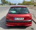 Красный Пежо 206, объемом двигателя 1.4 л и пробегом 195 тыс. км за 3700 $, фото 3 на Automoto.ua