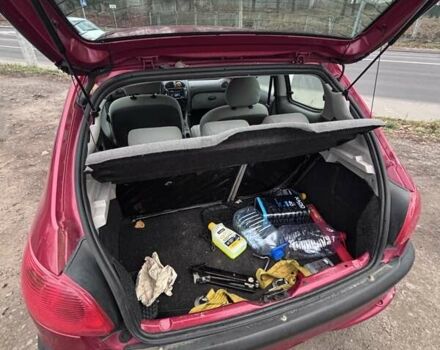 Червоний Пежо 206, об'ємом двигуна 1.12 л та пробігом 161 тис. км за 2200 $, фото 11 на Automoto.ua