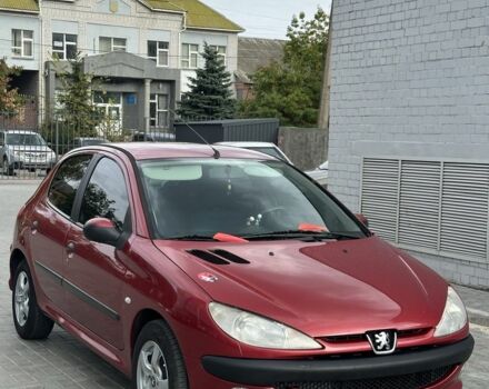 Красный Пежо 206, объемом двигателя 1.6 л и пробегом 195 тыс. км за 3750 $, фото 1 на Automoto.ua