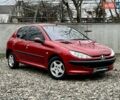 Красный Пежо 206, объемом двигателя 1.36 л и пробегом 232 тыс. км за 2990 $, фото 1 на Automoto.ua