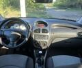 Красный Пежо 206, объемом двигателя 1.36 л и пробегом 280 тыс. км за 3200 $, фото 7 на Automoto.ua