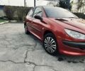 Красный Пежо 206, объемом двигателя 1.4 л и пробегом 241 тыс. км за 3200 $, фото 1 на Automoto.ua