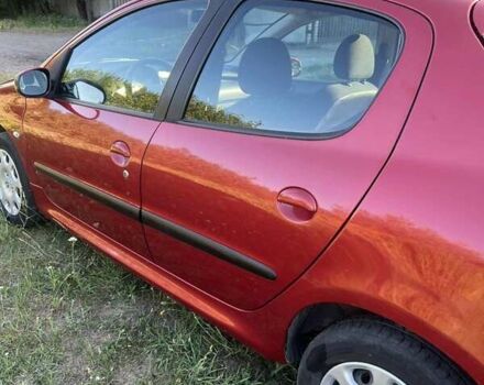 Красный Пежо 206, объемом двигателя 1.36 л и пробегом 280 тыс. км за 3200 $, фото 12 на Automoto.ua