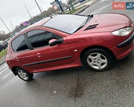 Красный Пежо 206, объемом двигателя 1.4 л и пробегом 231 тыс. км за 3400 $, фото 1 на Automoto.ua