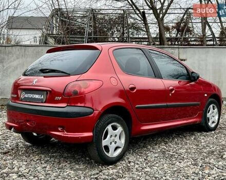 Красный Пежо 206, объемом двигателя 1.36 л и пробегом 232 тыс. км за 2990 $, фото 6 на Automoto.ua