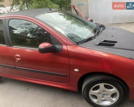 Красный Пежо 206, объемом двигателя 1.4 л и пробегом 221 тыс. км за 3300 $, фото 6 на Automoto.ua