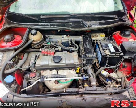 Червоний Пежо 206, об'ємом двигуна 1.4 л та пробігом 211 тис. км за 3000 $, фото 7 на Automoto.ua