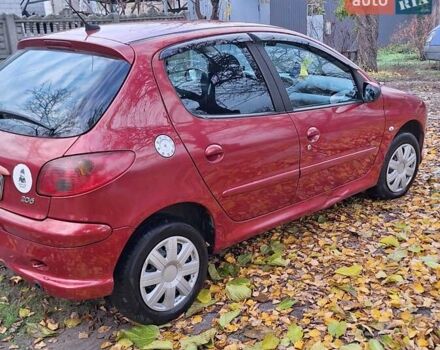 Красный Пежо 206, объемом двигателя 1.4 л и пробегом 199 тыс. км за 3900 $, фото 3 на Automoto.ua