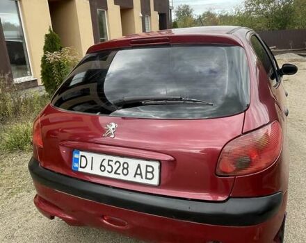 Красный Пежо 206, объемом двигателя 1.36 л и пробегом 181 тыс. км за 3900 $, фото 2 на Automoto.ua