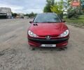 Красный Пежо 206, объемом двигателя 1.4 л и пробегом 260 тыс. км за 3130 $, фото 1 на Automoto.ua